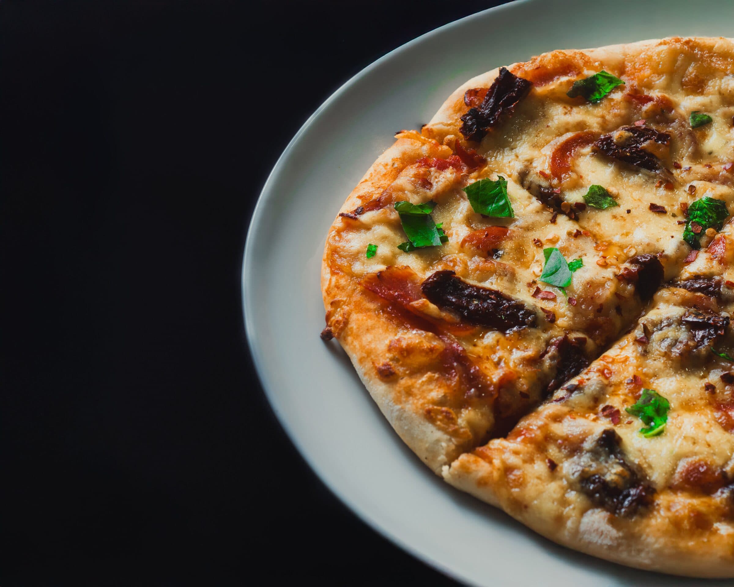 Detalle de pizza artesanal en Pizza Club